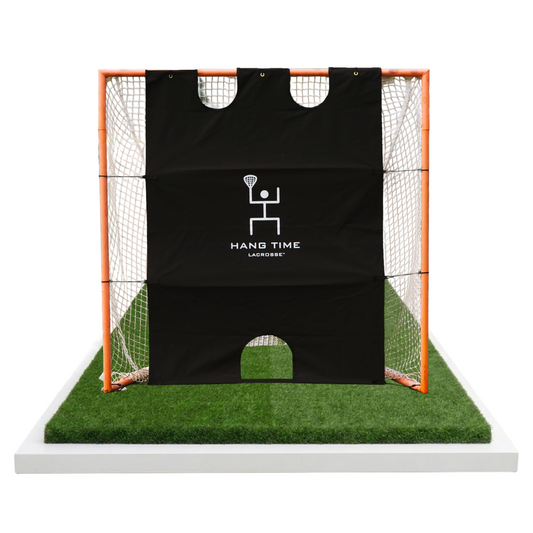 Pipe Painter Goal Blocker installed on a lacrosse goal, black canvas with cutout scoring zones