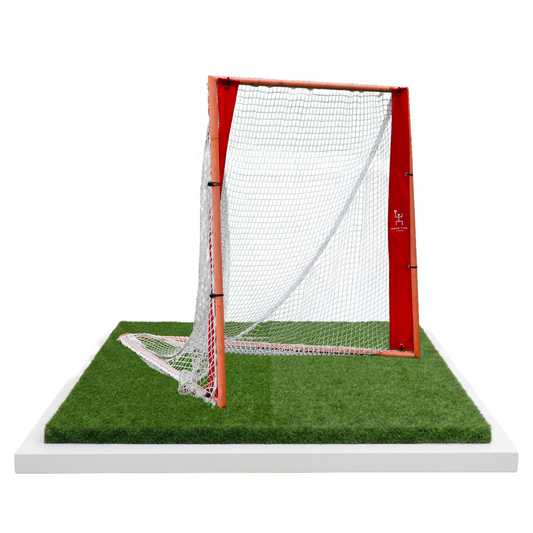 Angled view of lacrosse goal with red frame and Hang Time Lacrosse logo, ready for Pipe Stripes 2-Panel targets
