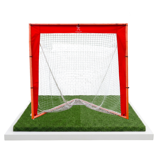 Lacrosse goal with red frame and Hang Time Lacrosse logo, set up for Pipe Stripes 3-Panel targets